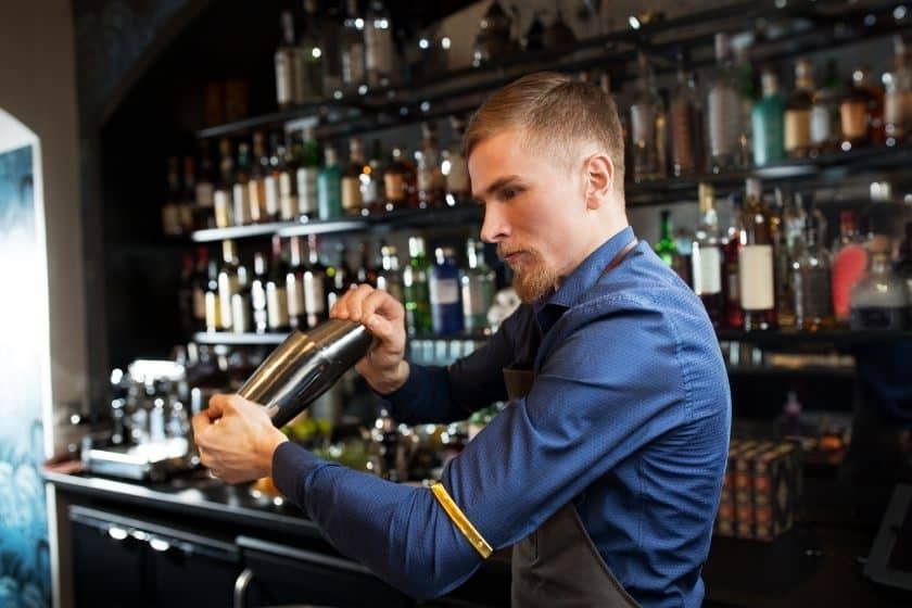 bartender about to shake tin on tin shaker