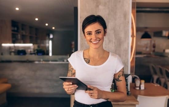 smiling restaurant manager