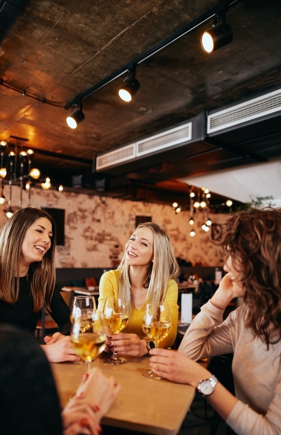 group of patrons drinking wine at a California restaurant