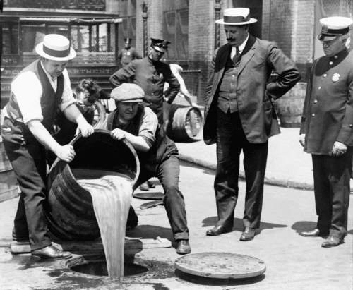 alcohol being poured out during prohibition